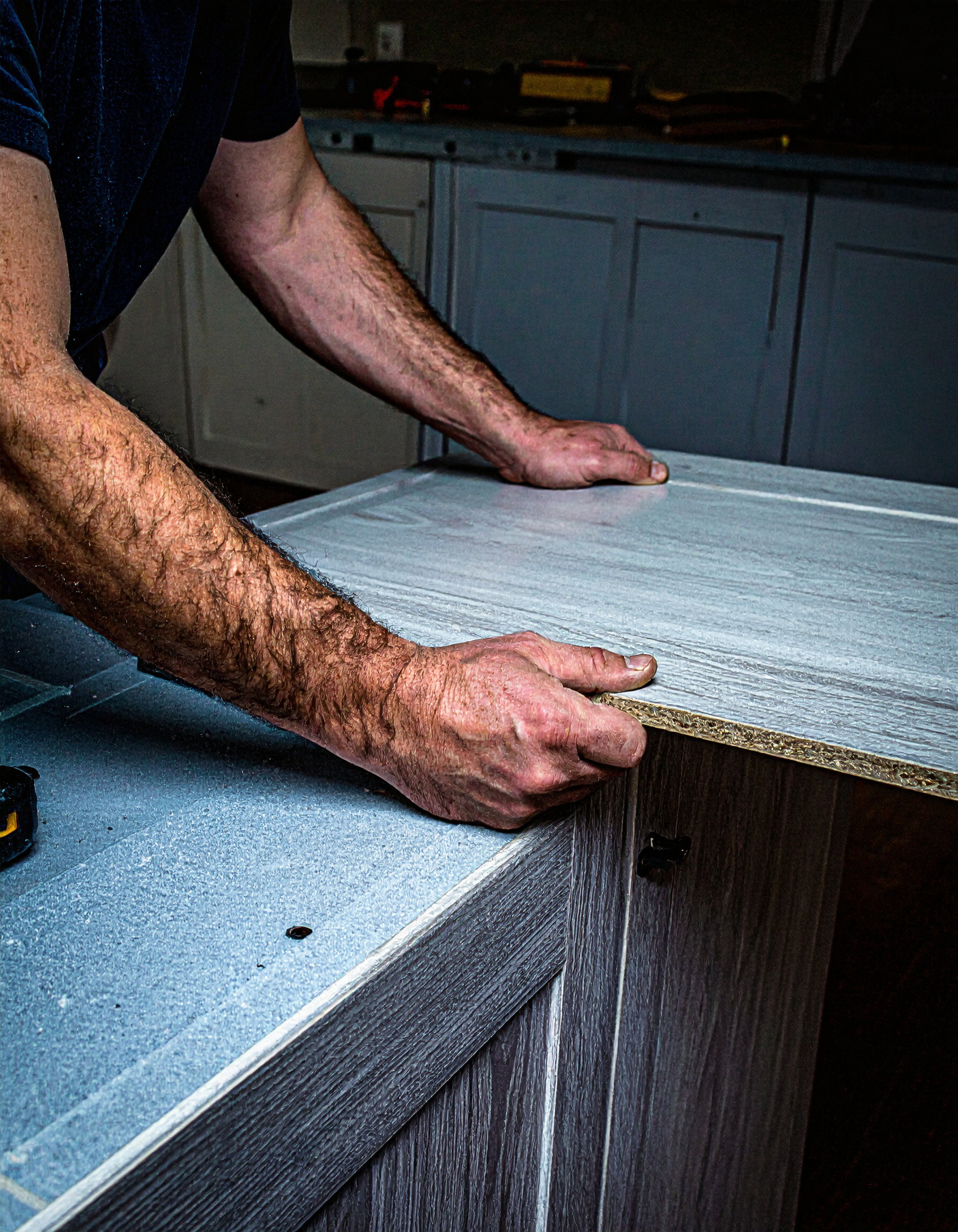 Firefly-kitchen-cabinet-installation-carpenter-is-assembling-the-cabinets-hands-are-correct-66251.jpg