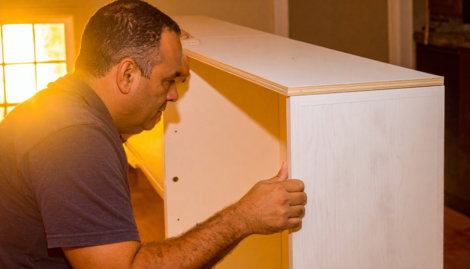 Firefly-kitchen-cabinet-installation-carpenter-is-installing-in-a-home-kitchen-hands-are-co-66251.jpg
